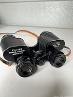 Front view showing Fullview Town & Country branding, 7x35 wide angle markings, eyepieces, lenses, and leather strap