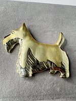 Front view of gold-tone Scottie dog brooch