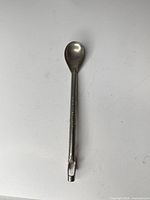Full view of chrome-plated long soda spoon