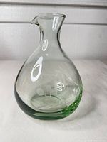 Full view of light green handblown glass carafe
