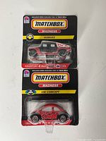 Front view of both sealed Matchbox Madness Humvee and VW Concept blister packs