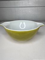 Side view showing yellow exterior and white interior