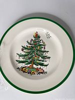 Front of plate showing Christmas Tree pattern and green rim