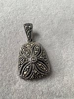 Front view showing overall shape and marcasite pattern