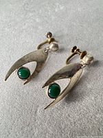 Front view showing overall design and cabochons