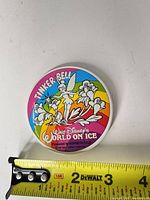 Full view of button with ruler showing diameter