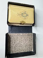 Prayer book inside original box, showing cream celluloid cover and interior lining