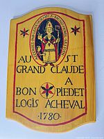 Front view of yellow MDF plaque showing French design and overall condition