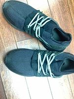 Top view of both shoes showing knit upper, laces, overall condition