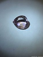 Top view of pear cut ametrine showing colour zoning