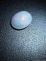 Top view of oval Ethiopian opal showing play-of-color
