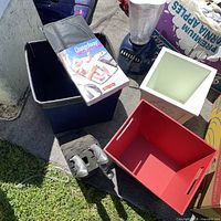 Grouping showing changing pad package, blender, patterned bin and red bin
