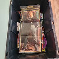 Top view of tote showing Kenny Rogers poster on top of assorted items