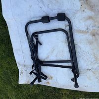 Full view of folded bike rack on white sheet