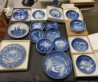 Group shot of all fifteen boxed Bing & Grondahl plates