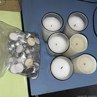 Bag of tealight candles and nearby pillar candles