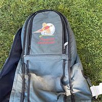 Front of green wheeled carrier showing embroidered logo and exterior pocket