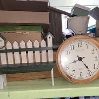 Clock and bench together on shelf