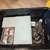 Overview of tote showing PartyLite box, poker set case and respirator