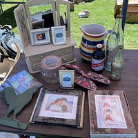 overview of jewelry box, frames, pitcher, Coca-Cola bottles, jar