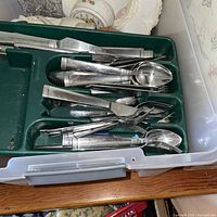 Close-up of flatware in green organizer inside tote