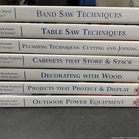 Spine view of six Handyman Club DVDs