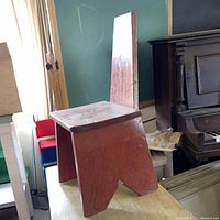 front view of child wooden chair showing seat and legs