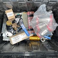 Top view of tote showing torch head, boxed parts, valve, cylinder and bagged accessories
