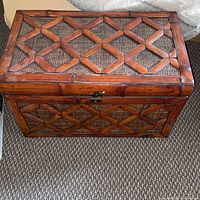 Front and side view of wood and cane chest