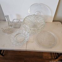 Group view of all six clear glass pieces