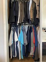Full view of closet with shirts and jackets on two levels