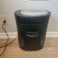Full view of paper shredder plugged in