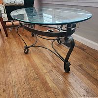 Side view showing glass top and metal base structure