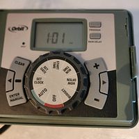 Control panel showing LCD screen, rotary dial, and buttons