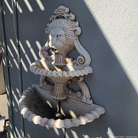 Full view of fountain mounted on wall