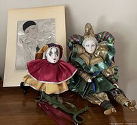 Overview showing both clown dolls and matted print