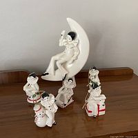 Group shot showing all four Pierrot clown pieces for scale and condition
