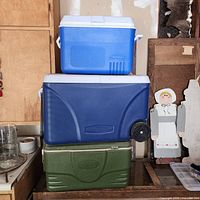 Front view of all three stacked Rubbermaid coolers