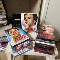 All seven Dexter DVD box sets stacked and arranged