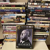 Front view showing two tall stacks of DVD cases plus Alfred Hitchcock 20-film box set
