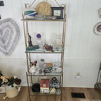 Full view of four-tier glass shelf and all contents
