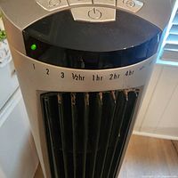 Close view of control panel and timer indicators on Lasko tower fan