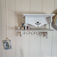 overall view showing both shelves and porcelain items