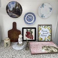 Overall lot showing plates on wall, countertop items