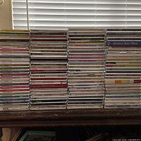 Full view of four tall stacks of CD jewel cases