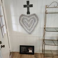 cross, heart mat, framed scripture art displayed on wall