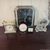 Group shot of all five clocks on tabletop