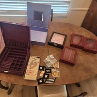 overview of all jewelry boxes, patches and ephemera on table