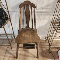 front view of spindle back wooden chair