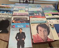 Overview of entire lot spread on table showing multiple LP titles